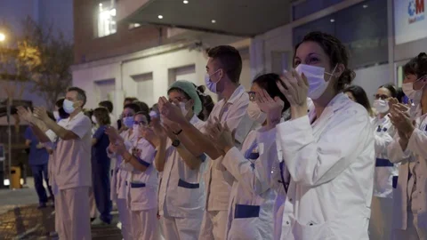 Coronavirus Outbreak in Spain: Medical workers applauding Stock Footage