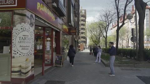 Coronavirus Outbreak in Spain: people queueing at a bakery Stock Footage 132631033