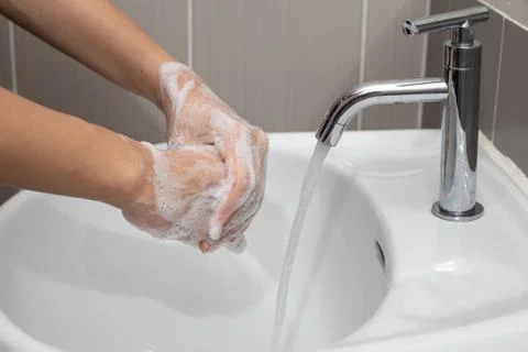 Coronavirus pandemic prevention by  wash hands and fingers with soap for freq Stock Photos