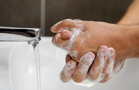 Coronavirus pandemic prevention wash hands with soap Stock Photos