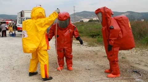 Coronavirus Protective suits Conduct Decontamination firefighters covid-19 Stock Footage