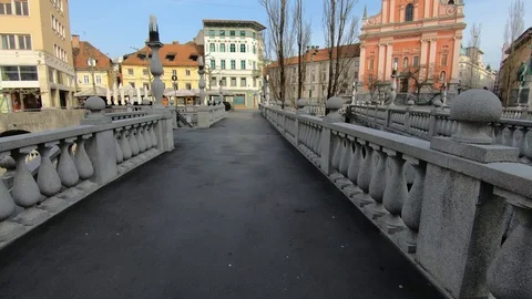 Coronavirus quarantine, almost empty main square and Triple Bridge on workday Stock Footage 128145116