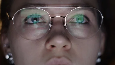 CORONAVIRUS: The reflection at the glasses of working home woman 스톡 동영상 125756693