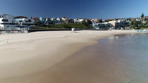 Coronavirus shuts Bondi Beach Australia during COVID 19 Pandemic - Drone Video Stock Footage 129791106