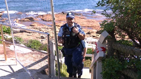 Coronavirus shuts down Bondi Beach in Australia during global COVID 19 Pandemic Stock Footage 129401892