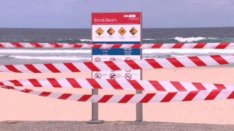 Coronavirus shuts down Bondi Beach in Australia during global COVID 19 Pandemic Stock Footage 129637872
