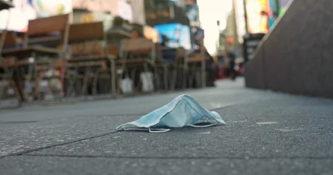 Coronavirus shuts down Broadway. Discarded Surgical Mask. Stockbeeldmateriaal 126294937