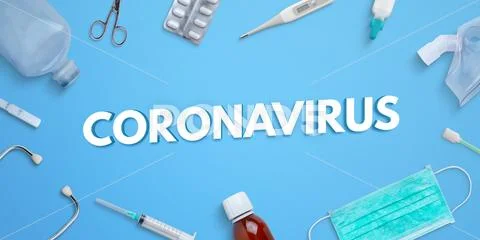 Coronavirus text on blue desk surrounded by medical equipment and medicines Modello PSD