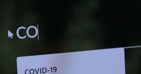 "CORONAVIRUS" typing into search engine on computer Screen Stock Footage 127493465