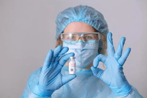 Coronavirus vaccine. Doctor with a vaccine. Nurse holding a coronavirus vacci Stock Photos