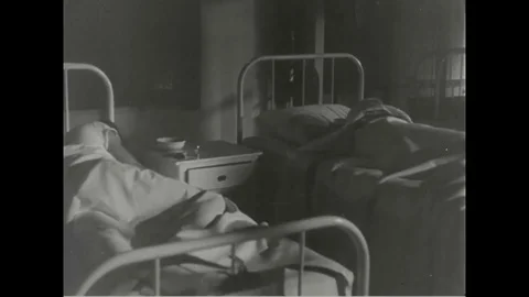 Corporal Ben Edwards and other patients in a hospital ward - 1952 Stock Footage 101405342