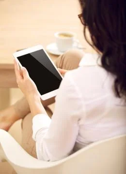 Corporate assistant looking at her tablet's empty screen Stock Photos