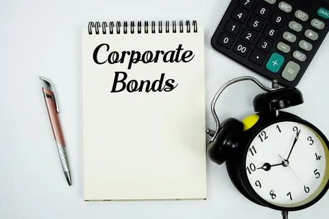 Corporate Bonds text written on notepad with calculator and alarm clock Stock Photos