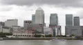 Corporate Building Canary Wharf London Skyline UK Business Downtown Boat Passing HD Footage