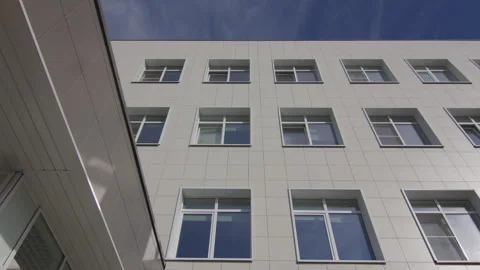 Corporate building shows windows and covered entrance roof Stock Footage 335643848