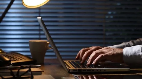 Corporate businessman working late at night Stock Footage
