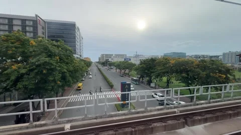 Corporate district view from moving train window in Parañaque 4K Vídeos de archivo 337980009