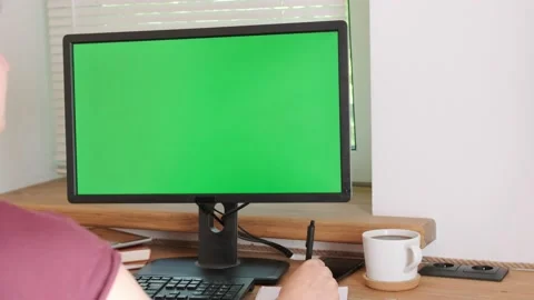 Corporate employee using computer with horizontal green screen for business Stock Footage