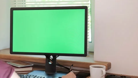 Corporate employee using computer with horizontal green screen for business Stock Footage