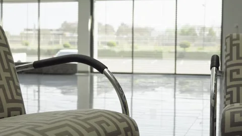 A Corporate environment interior with a comfortable chair and a reflective tile Stock Footage 250481768