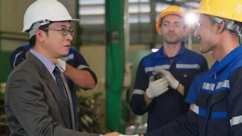 Corporate Executive Shaking Hands with Diverse Factory Workers in Plant. Stock Footage 343428703