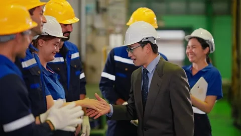 Corporate Executive Shaking Hands with Diverse Factory Workers in Plant. Stock Footage 343428909