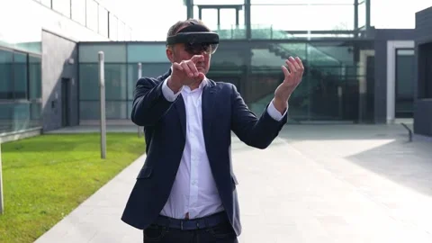Corporate Executive Using VR to Point and Interact in Modern Environment Stock Footage 275860876