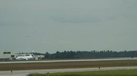 Corporate jet rolls through frame 2 Stock Footage 112614