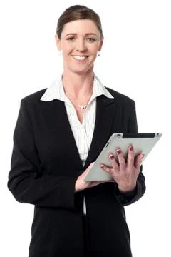 Corporate lady working on tablet device Stock Photos