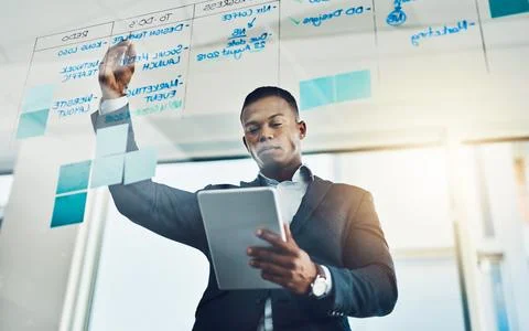 Corporate, man and notes on tablet on glass of schedule planning, daily task and Stock Photos