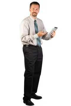 Corporate Man Standing and Using a Tablet Stock Photos
