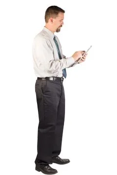 Corporate Man Standing While Using Tablet Stock Photos