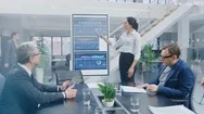 In The Corporate Meeting Room Female Analyst Uses Digital Interactive Whiteboard Stock Footage