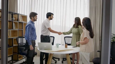 Corporate office executives shaking hands to collaborate to form a partnership Stock Footage 295416045