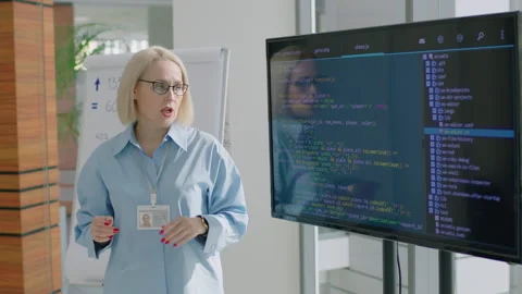 Corporate Worker Explaining New Source Code Stock Footage 256300715