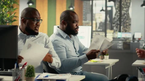 Corporate workers meeting with executive management to assess objectives Stock Footage 320745186