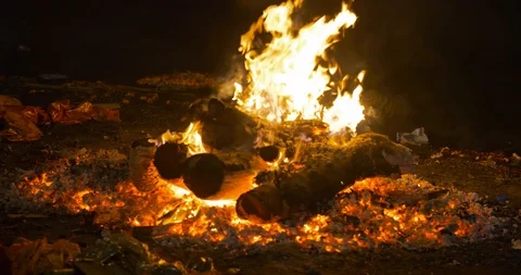 A corpse of dead people burning in Manikarnika ghat at night, Varanasi, India Stock Footage 113992828