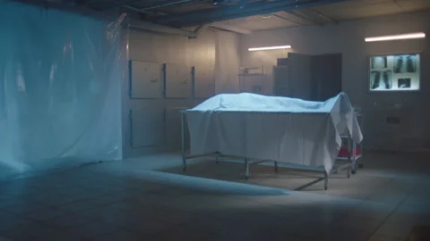 Corpse under the cover in the morgue Stock Footage 283146412