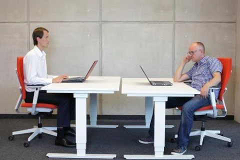 Correct and bad sitting position at desk Stock Photos