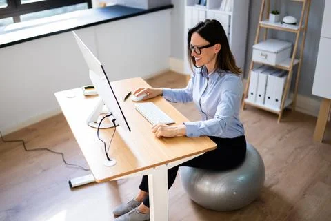 Correct Posture At Desk In Office Stock Photos
