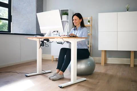 Correct Posture At Desk In Office Stock Photos