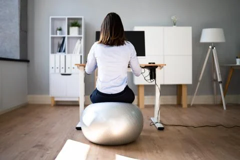 Correct Posture At Desk In Office Stock Photos