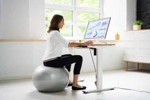 Correct Posture At Desk In Office Stock Photos