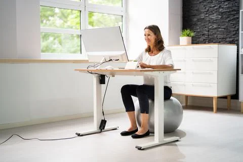 Correct Posture At Desk In Office Stock Photos