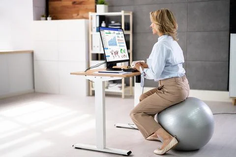 Correct Posture At Desk In Office Stock Photos