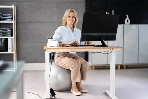 Correct Posture At Desk In Office Stock Photos