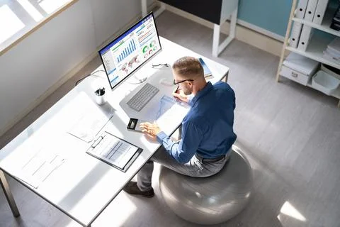 Correct Posture At Desk In Office Stock Photos