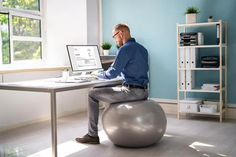 Correct Posture At Desk In Office Stock Photos