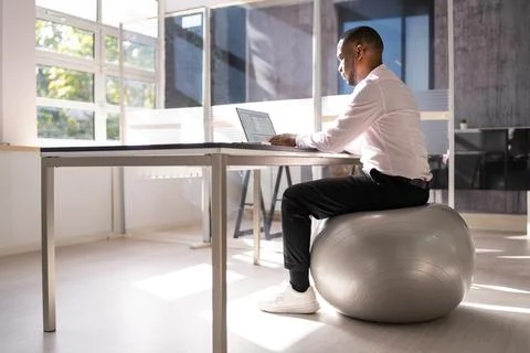 Correct Posture At Desk In Office Stock Photos