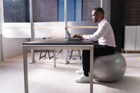 Correct Posture At Desk In Office Stock Photos